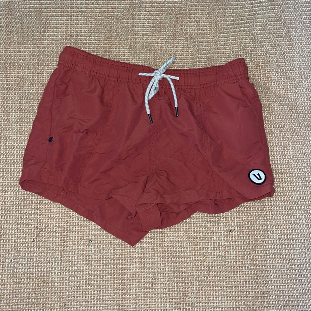 Brick colored Vuori workout shorts